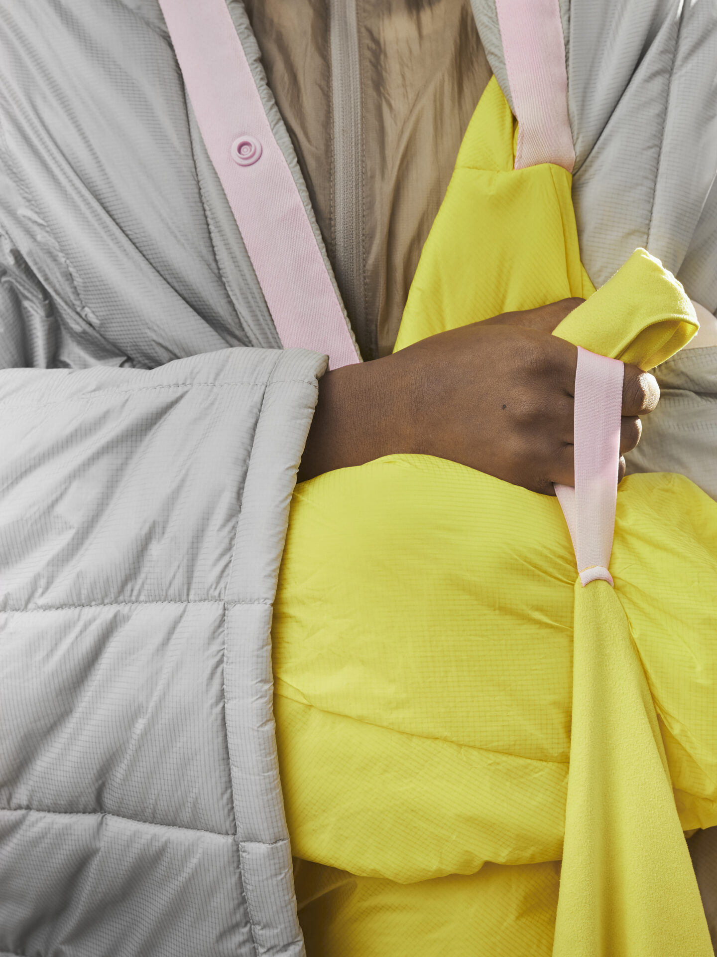 Close up on grey and yellow robe worn on woman